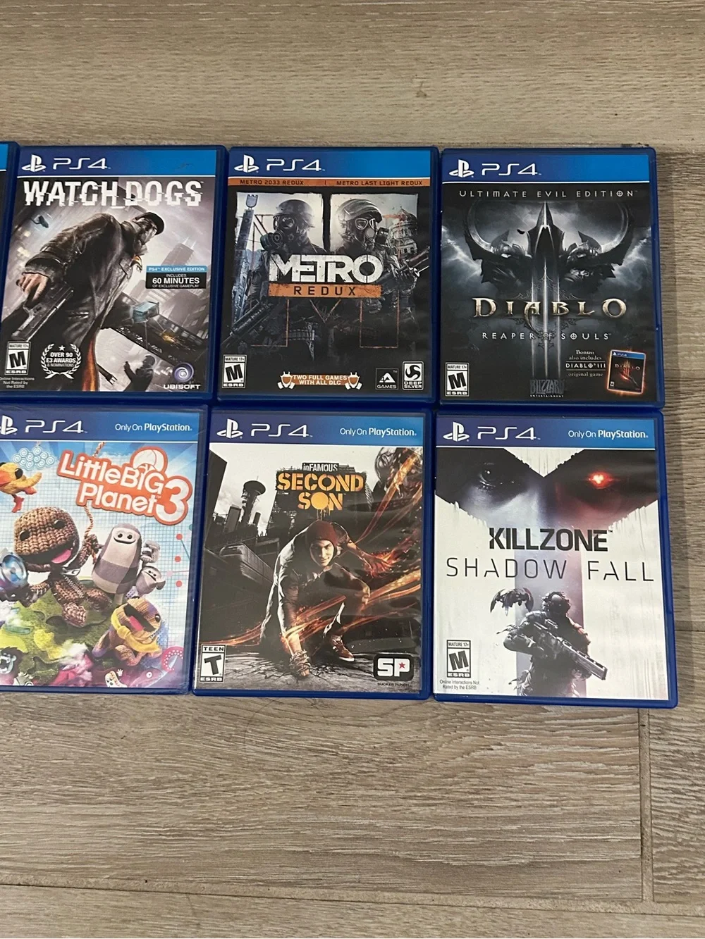 PlayStation 4 Video Games Lot (8) (Watch Dogs, Metro Redux, Batman, Far Cry 4)